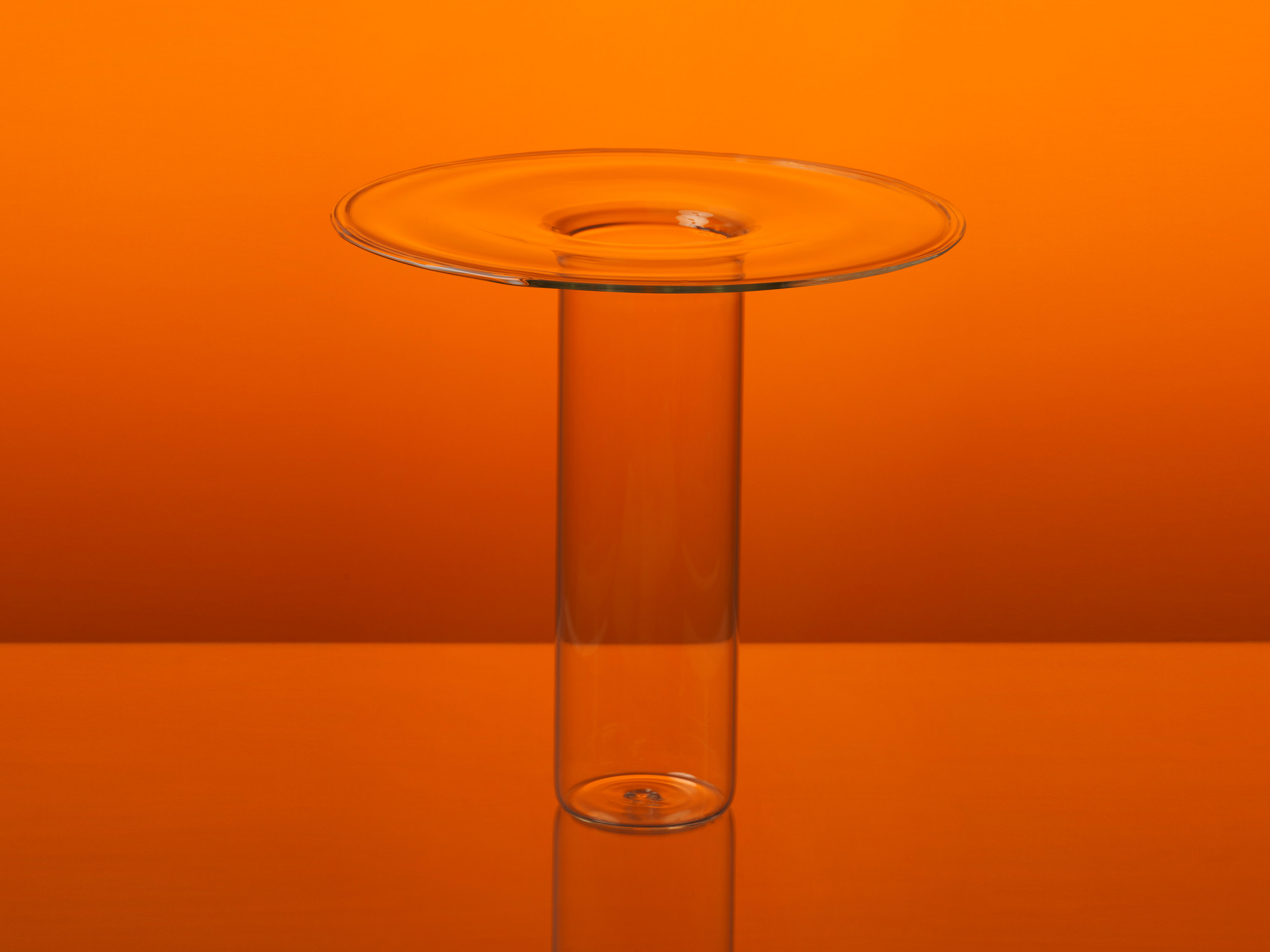 Glass vase on an orange background